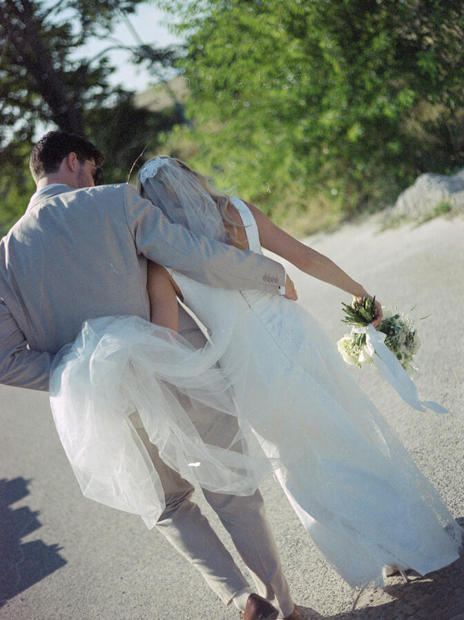 bride and groom walking and cuddling bride and groom walking and cuddling